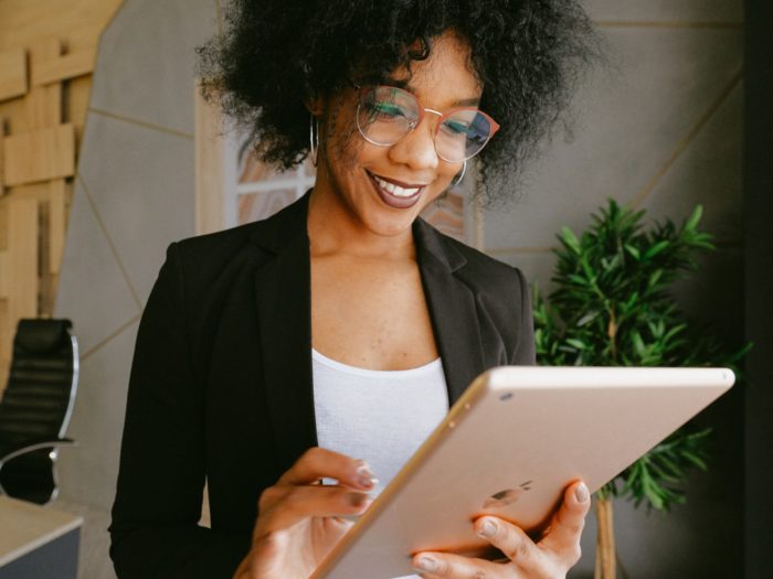 woman-in-black-blazer-holding-an-ipad-3727457