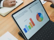 photo-of-ipad-on-top-of-wooden-table-3734603