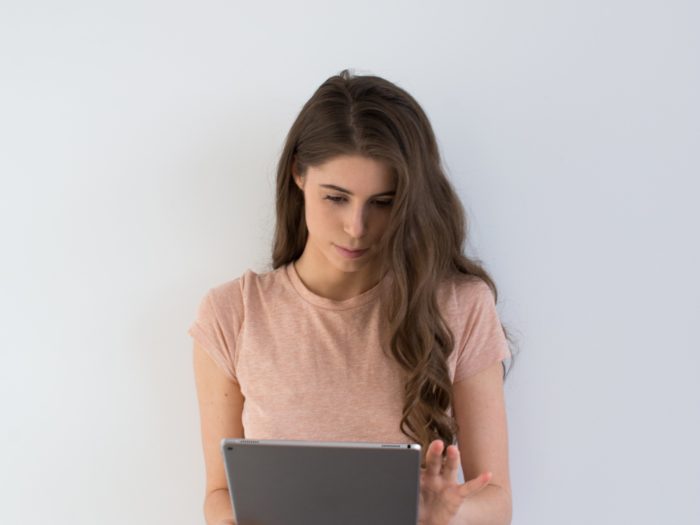 Young woman browses the news online